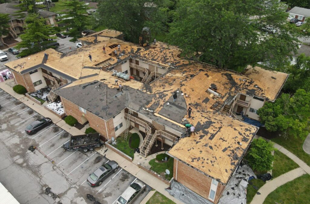 A Emerald Roofing and Siding team member delivering roof repair in Montvale, NJ, demonstrating the benefits of using a local professional for this essential service.