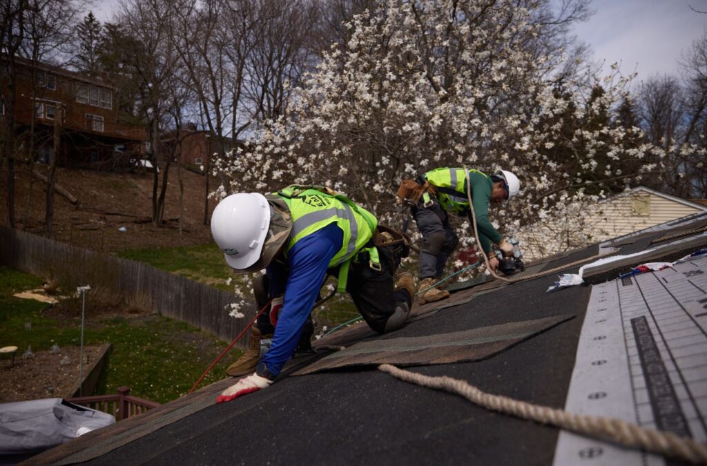 Expert from Emerald Roofing and Siding working on roof installation in West Nyack, NY showing precision and local trust. Roof Installation near me.