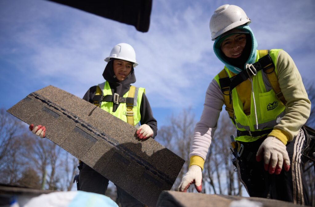 Emerald Roofing and Siding team member installing a new roof in Tappan, NY highlighting the advantages of professional local service.