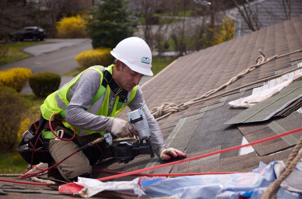 Emerald Roofing and Siding expert working on a new roof installation in Woodcliff Lake, NJ highlighting precision and reliability.