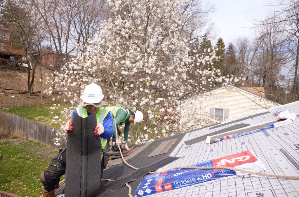 An Emerald Roofing and Siding technician working on a roof installation in Tappan, NY showcasing trusted local craftsmanship. Roof Installation near me.