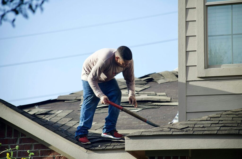 An Emerald Roofing specialist carefully sealing flat roof seams and transitions on an Upper Saddle River property to ensure long-term leak protection